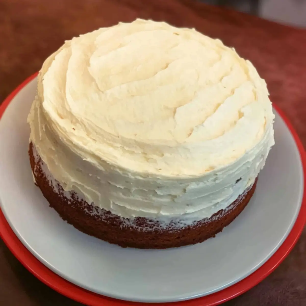 Two golden Divorce Carrot Cake layers cooling on wire racks before frosting application